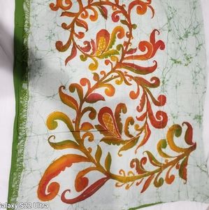 Handwoven batik dyed green, orange, white and silver thread cotton Saree